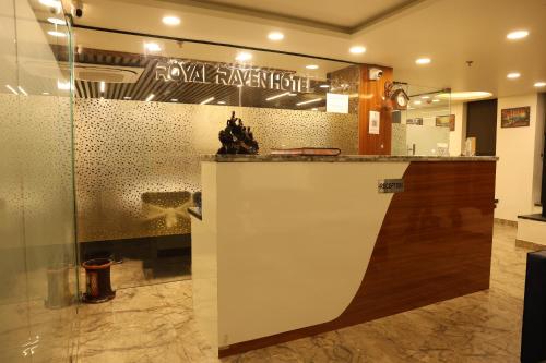 a lobby with a counter in a building at Royal Raven Hotel & Banquet' Greater Noida Nearby India Expo Centre & Mart in Greater Noida