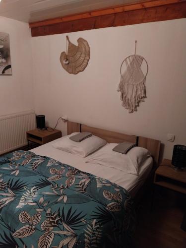 a bedroom with a bed and a basket on the wall at Gites panoramique in Sainte-Livrade-sur-Lot