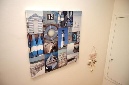 a collage of photographs hanging on a wall at La Sciabbega B&b in Porto Recanati