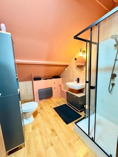 a bathroom with a toilet and a sink at Bright loft-style duplex 6 people Dunkirk in Coudekerque-Branche