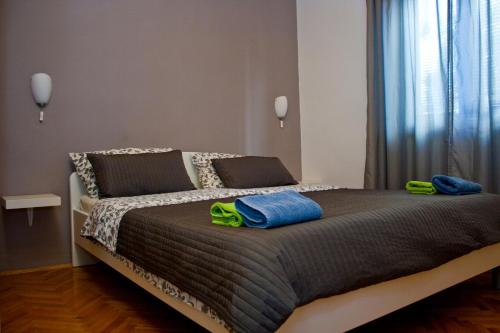 Postel nebo postele na pokoji v ubytování Apartments Merlin