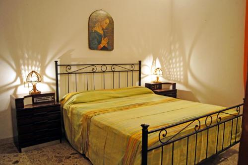 En eller flere senger på et rom på Villa Alba Appartamenti