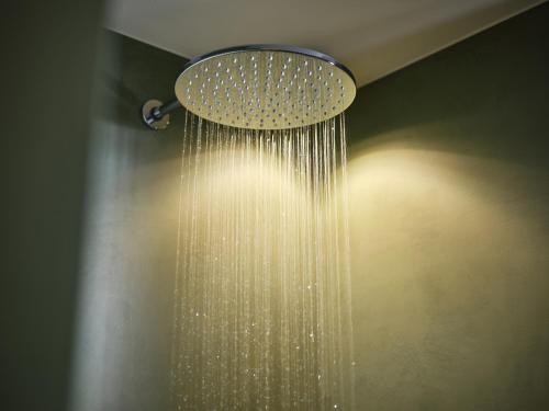 a shower with a droplet of water hanging from it at Alpe di Susi in Castelrotto