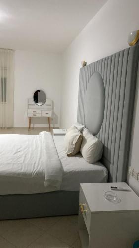 a hotel room with a bed and a mirror at Big Villa In Rabat in Rabat