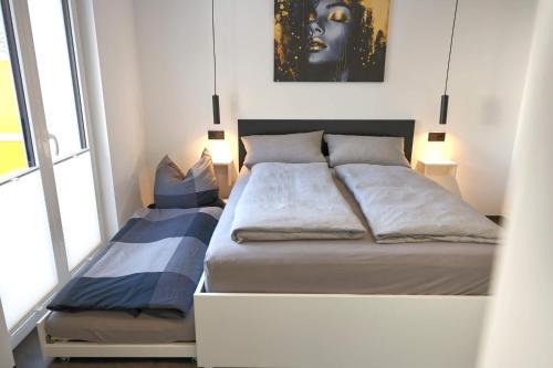 a small bedroom with a bed and a window at Ferienwohnung Petra in Ilmenau