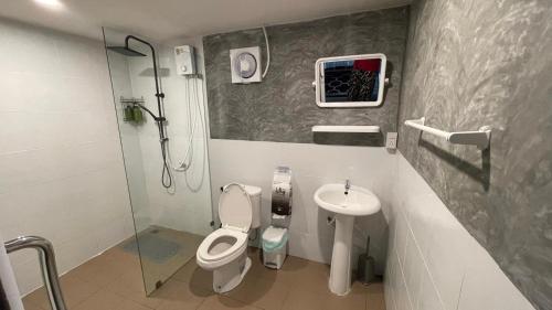 a small bathroom with a toilet and a sink at Secret Garden House - 2BR Cozy Home with Garden & Workspace in Ban Tai