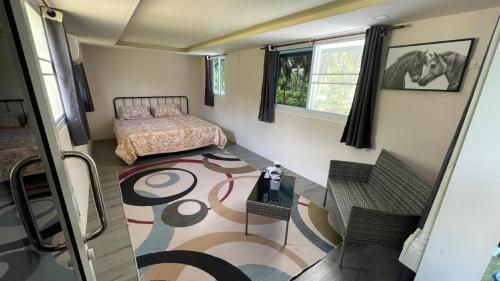 a bedroom with a bed and a table and chairs at Secret Garden House - 2BR Cozy Home with Garden & Workspace in Ban Tai