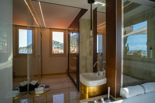 a bathroom with a sink and a shower at Grand Hotel Alassio Beach & Spa Resort - The Leading Hotels of the World in Alassio