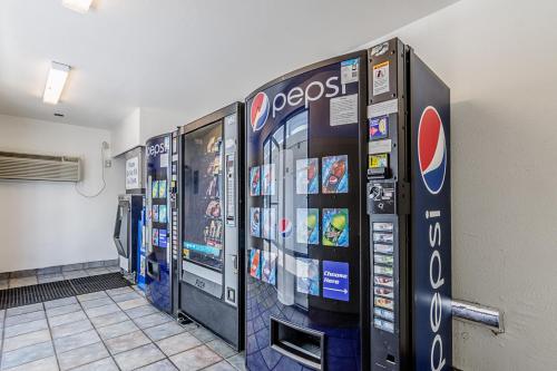 a row of video games machines in a building at Motel 6 Modesto, CA in Modesto