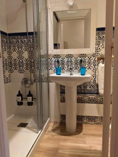 a bathroom with a sink and a shower at Casa Consell Bailen, Guest House in Barcelona
