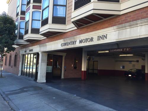 a building with a sign that readsancy motor inn at Coventry Motor Inn in San Francisco