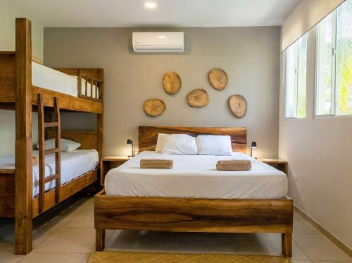 a bedroom with two bunk beds and two bunkunks at Casaola Mizata in Santa María Mizata