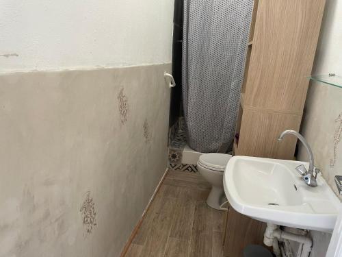 a bathroom with a sink and a toilet at Vue de rêve in Cassis