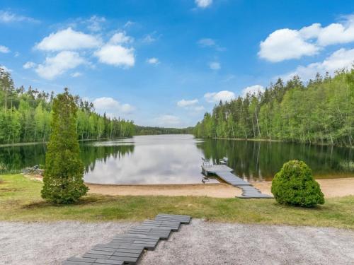 a view of a lake with a dock at Holiday Home 7734 by Interhome in Kaartilankoski
