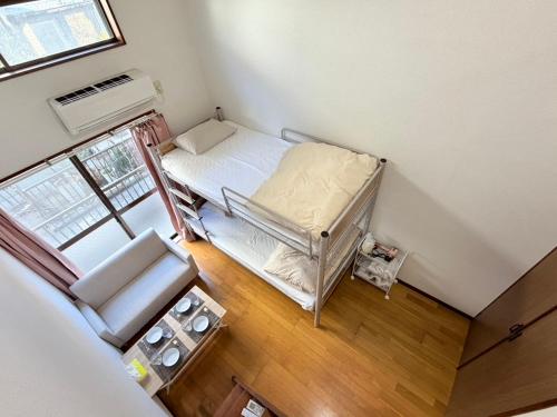 an overhead view of a small room with a bed at ハイツロフト102 in Nagasaki