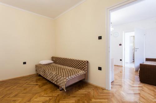 a room with a couch in the corner of a room at Apartment Marija in Zagreb