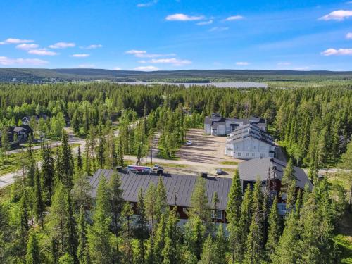an aerial view of a building in a forest at Holiday Home Yllästar 3 as 616 by Interhome in Äkäslompolo