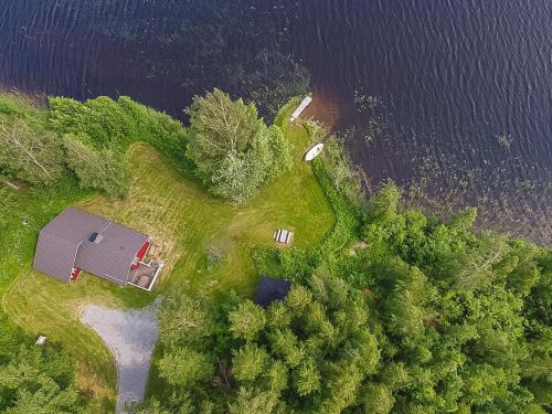 an aerial view of a house next to a lake at Holiday Home Pajaranta by Interhome in Hara