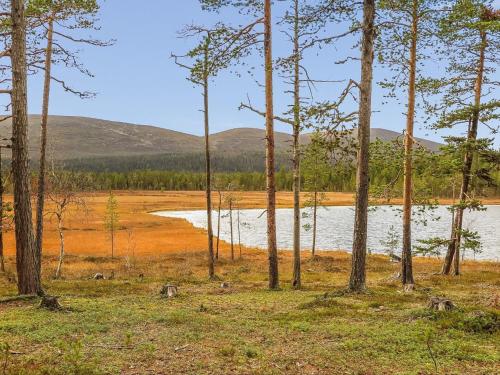 a body of water in a field with trees at Holiday Home Homma by Interhome in Kyrö