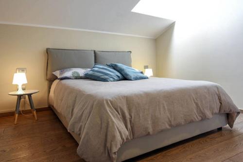 a bedroom with a bed with two pillows on it at B&B Portanova in Salerno