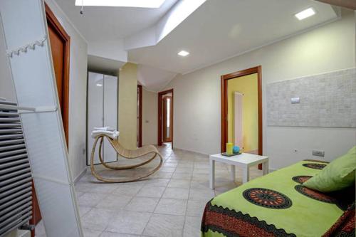 a room with a bedroom with a bed and a chair at B&B Portanova in Salerno