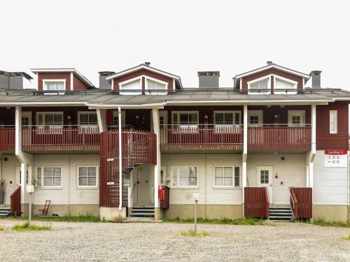 a large building with red balconies on it at Holiday Home Levi star 1009 by Interhome in Levi