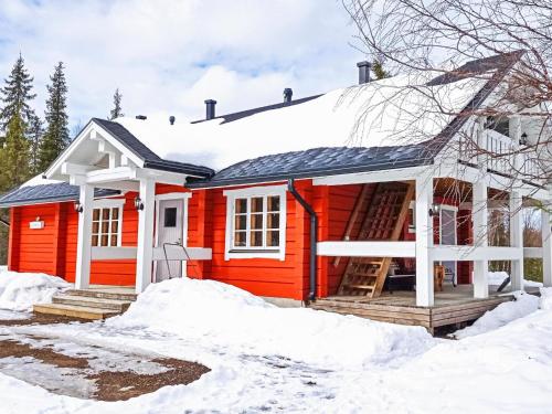 a red house in the snow at Holiday Home Vuonkuma by Interhome in Äkäslompolo