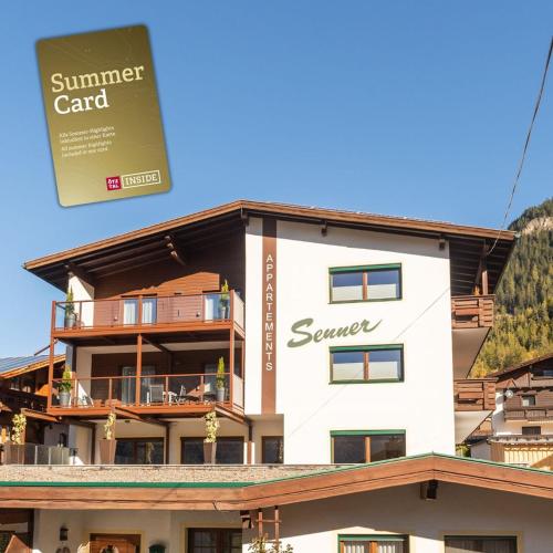 a building with a sign that reads summer card at Senner Appartements in Umhausen