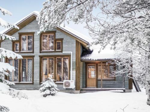 a house in the snow with snow covered trees at Holiday Home Rome 10 by Interhome in Syöte