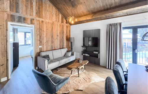 a living room with a couch and chairs and a table at Ferienwohnung 1 Stock in Afritz