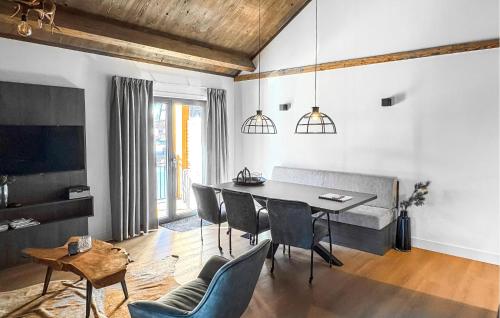 a living room with a dining room table and chairs at Ferienwohnung 1 Stock in Afritz