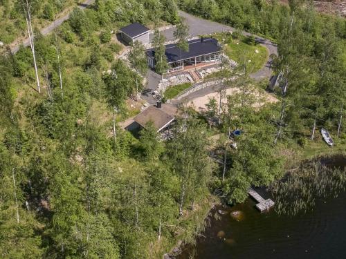an aerial view of a house next to the water at Holiday Home Riemukaari by Interhome in Lihavanpää