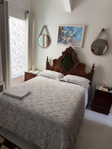 a bedroom with a large bed and a window at Pousada 48 Graus - Caldas do Jorro BA in Poço Redondo