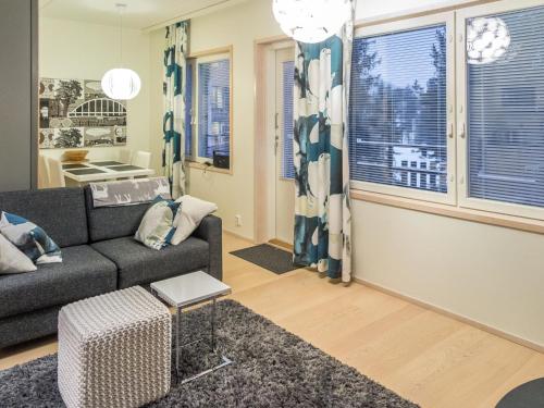 a living room with a couch and a window at Holiday Home Levin stara c11 by Interhome in Levi