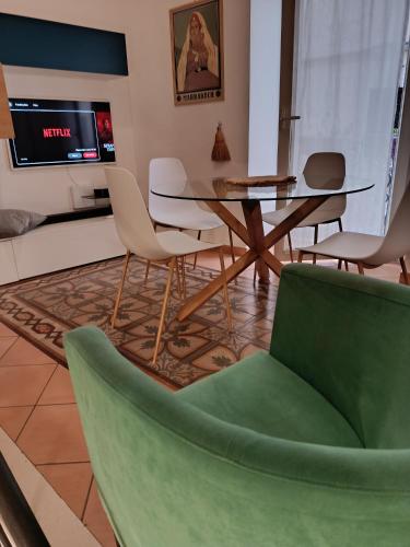a living room with a table and chairs at Lydian Suite in Bari