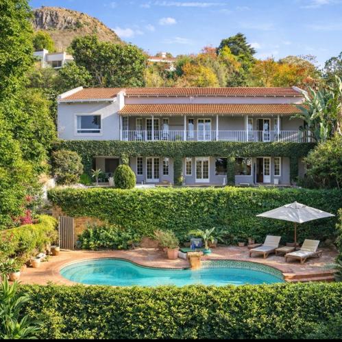 an image of a house with a swimming pool at Ekhaya in Hartbeespoort