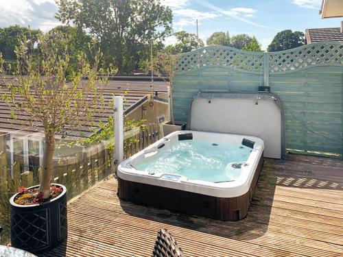 a hot tub sitting on top of a deck at Highview in North Walsham