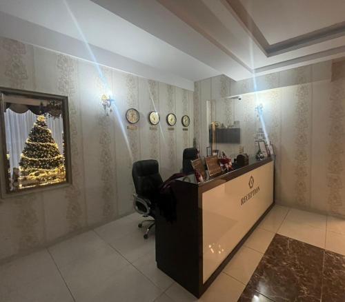 a room with a christmas tree on the wall at MariaLuis Hotel in Tbilisi City