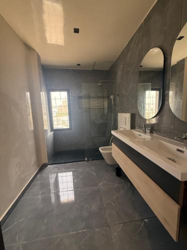 a bathroom with a sink and a toilet at HJ Appartements Haut Standing in Nouakchott
