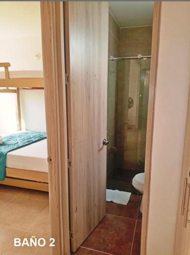 a bathroom with a shower and a toilet in a room at Capriella,Cartagena in Cartagena de Indias
