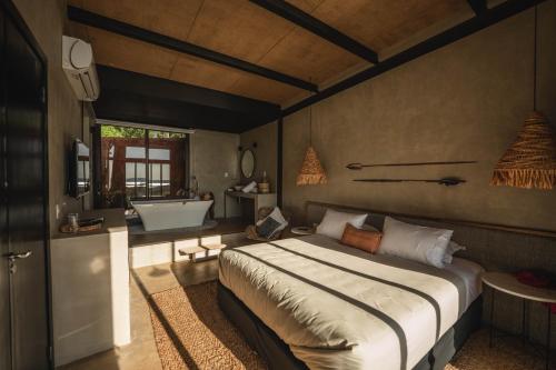 Tempat tidur dalam kamar di Tava Glamping Cerro