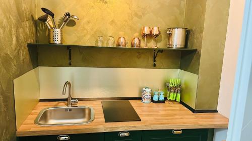 a kitchen with a sink and a counter top at ConteMax ArtHouse in Salerno