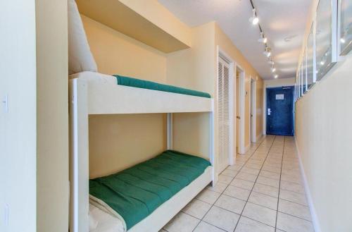a hallway with bunk beds in a room at 0709 Seaside Serenade by Atlantic Towers in Carolina Beach
