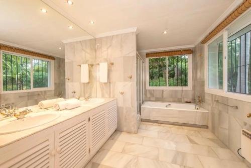 Villa in palm tree plantation, near the beach.