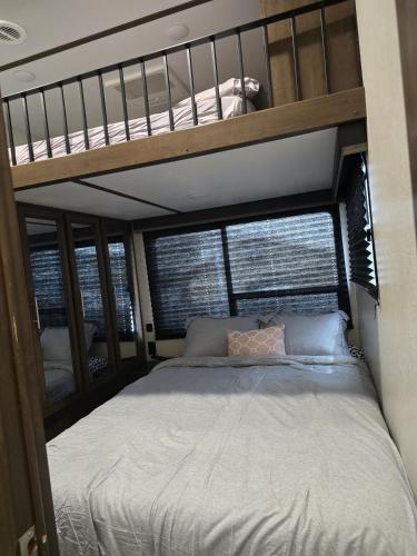 a bedroom with two bunk beds in a house at Courtside Villa at Key Largo in Key Largo