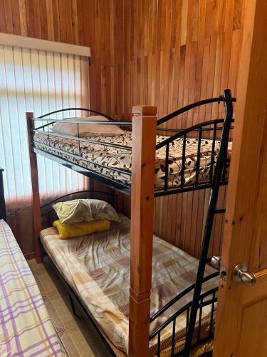 a couple of bunk beds in a room at Cabañas Luz de Luna in Llano Grande