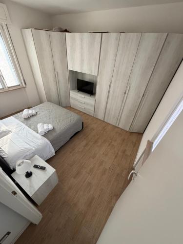 a small bedroom with a bed and a fireplace at Santa Rita Home in Novara