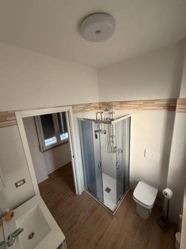 a bathroom with a shower and a toilet at Santa Rita Home in Novara