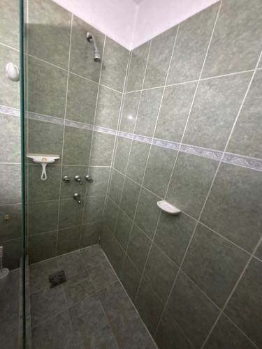 a bathroom with a shower with a glass door at Casa céntrica en calle CB 297 in Villa Carlos Paz
