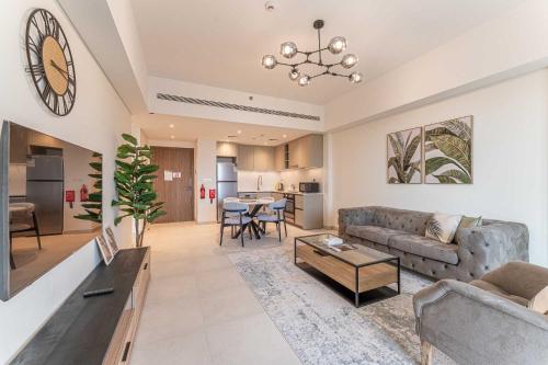 a living room with a couch and a table at HAVN - 1 bedroom in Madinat Jumeirah Living in Dubai